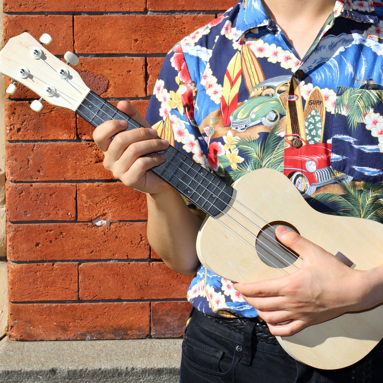 Local man playing the ukulele hi-res stock photography and images